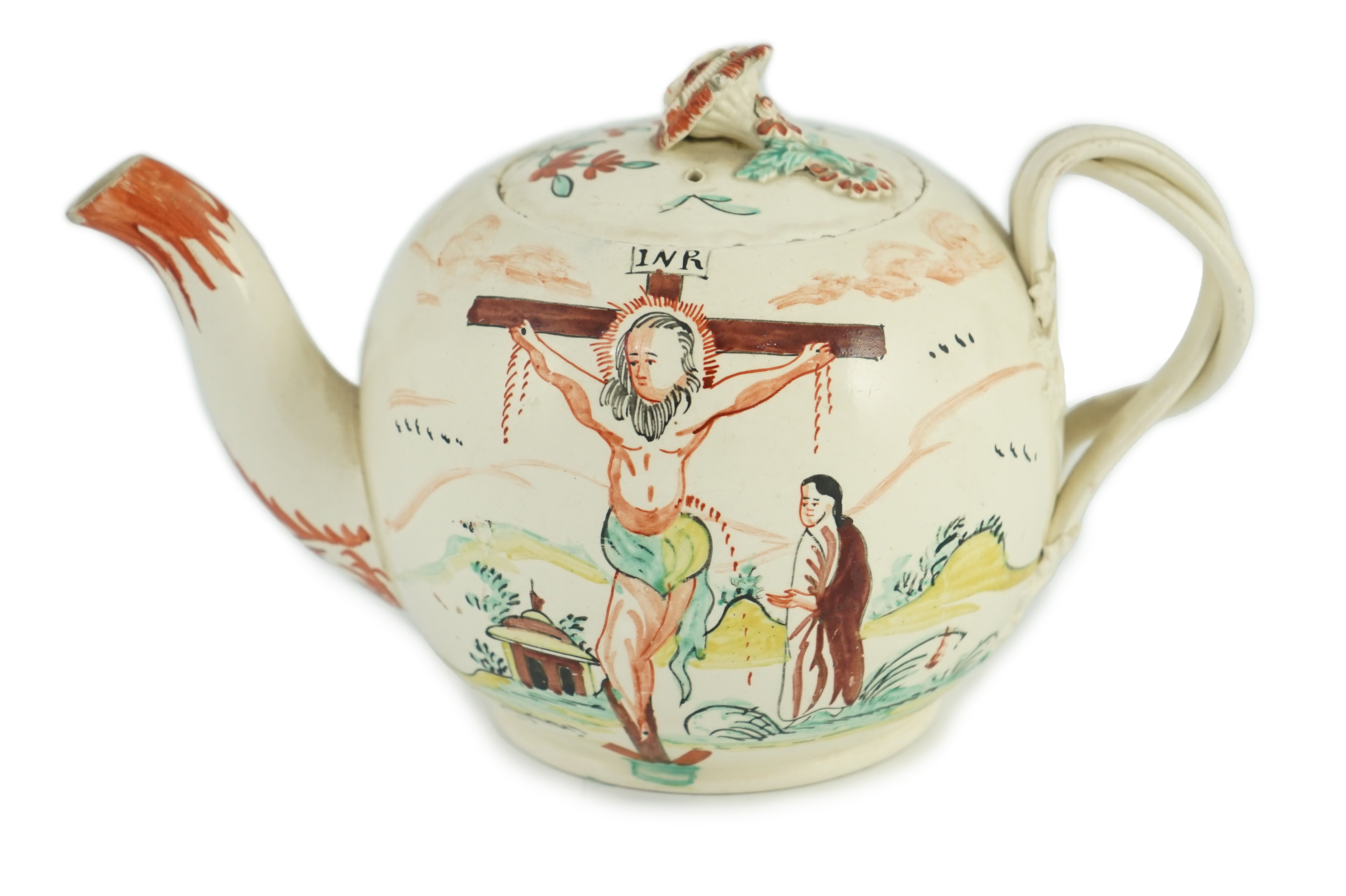 A rare English creamware ‘crucifixion’ teapot, c.1780-1800, 20cm spout to handle, tiny chips